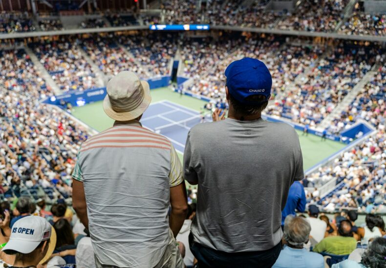 a couple of men in a stadium