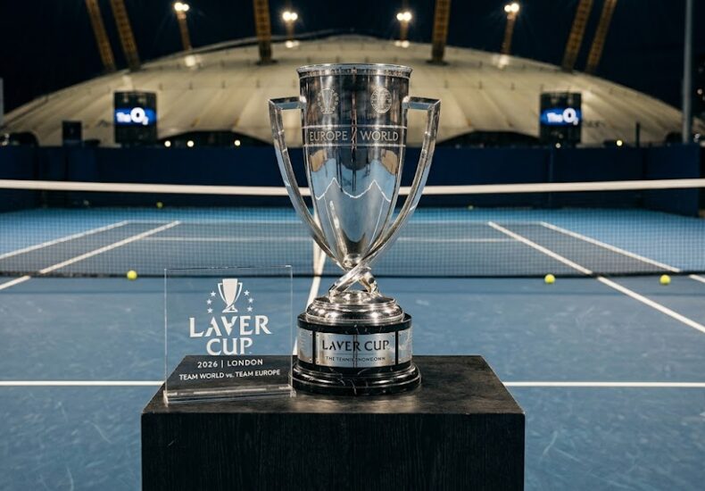 Trophy of the 2026 Laver Cup 'Team World vs Team Europe' in front of London's O2 Arena with the tennis court in the background. Official tournament trophy and branding.